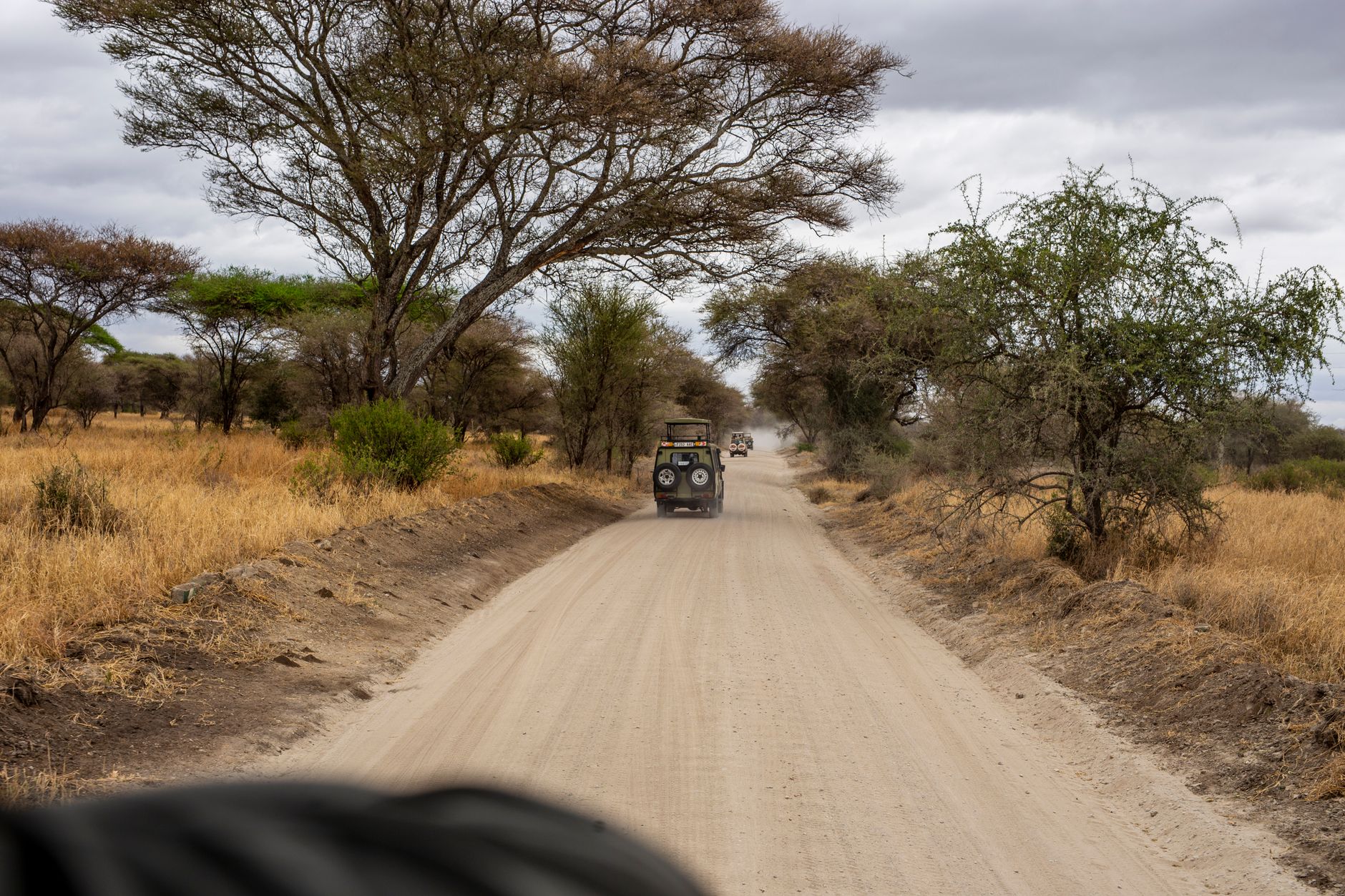 Game drive safari vehicle viewing wildlife in Kenya