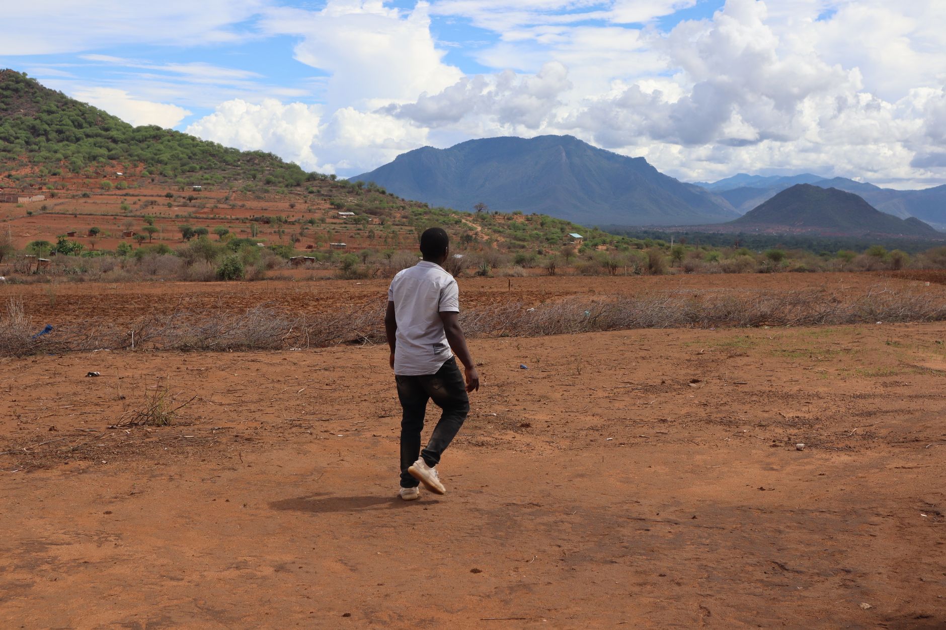 Walking safari guide leading guests in Kenya